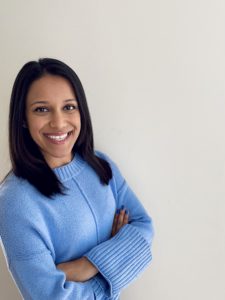 Aakansha smiling with arms crossed